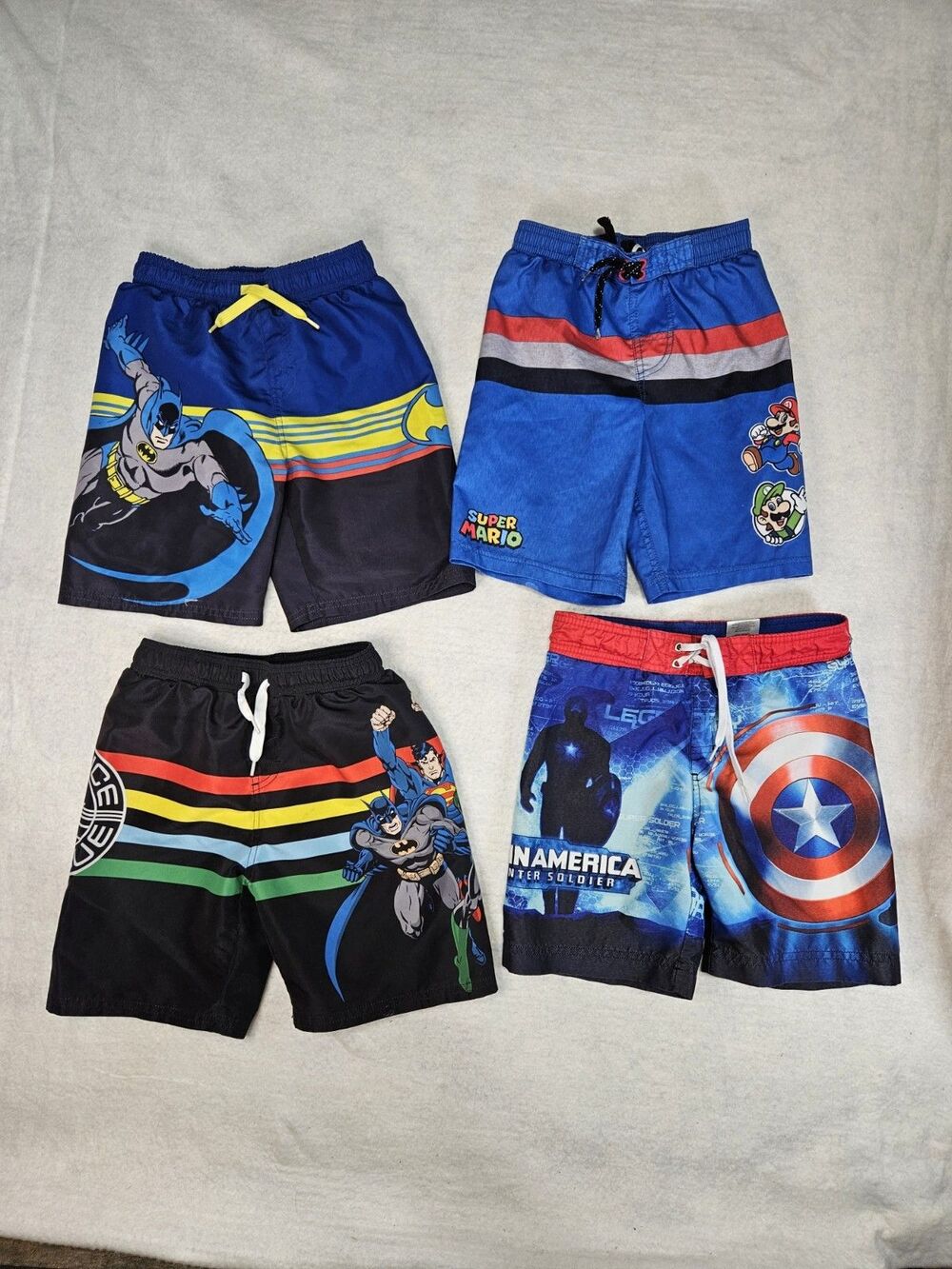 Boys Size Small Swim Trunks Lot Of 4 Mario Captain America Batman Justice League